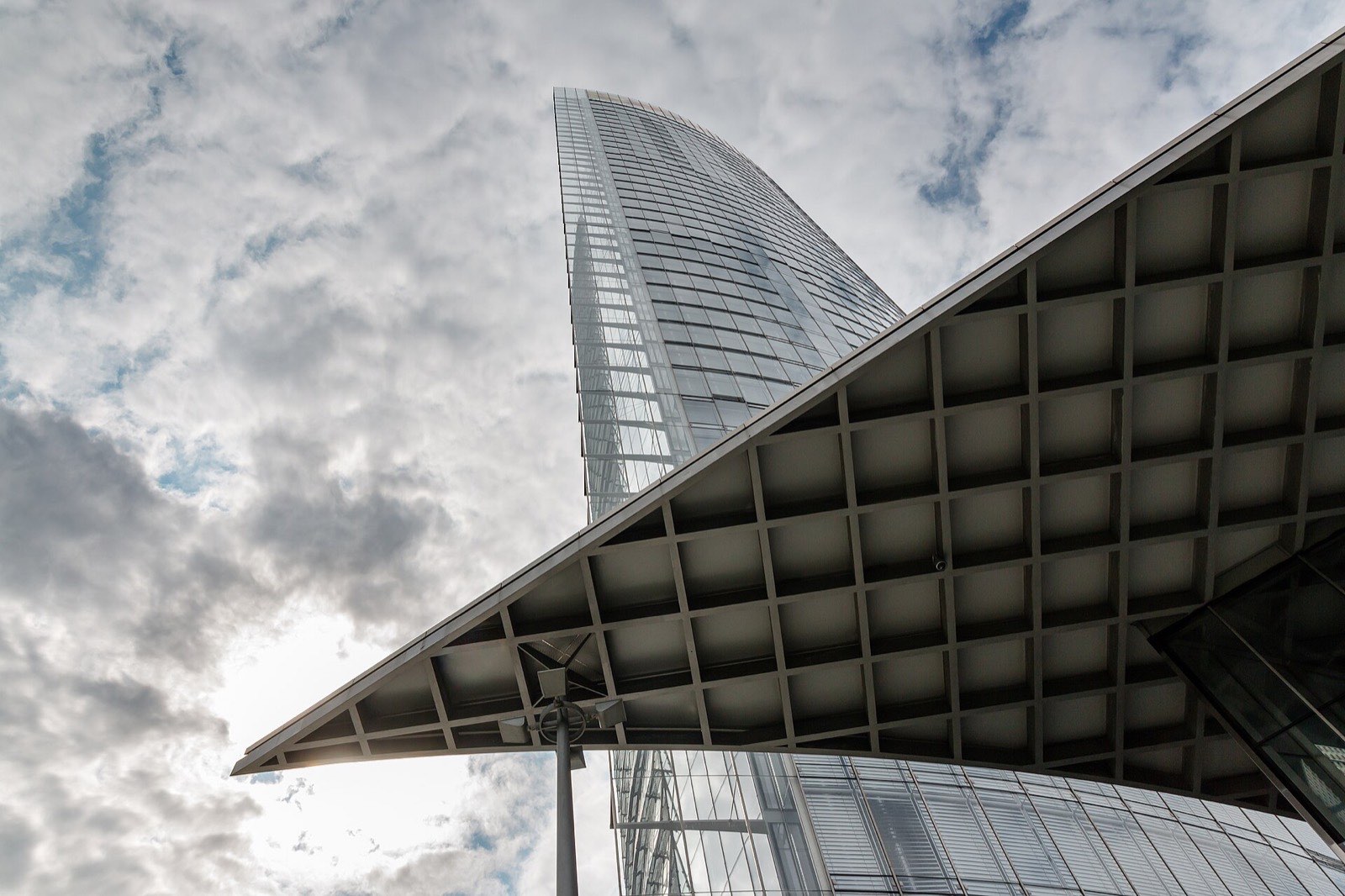 Modern high-rise tower against an open sky